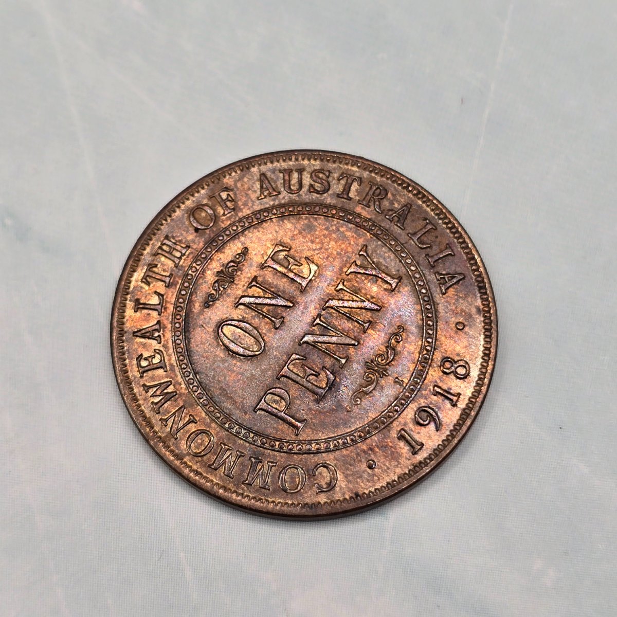 1918I Penny struck at the Calcutta Mint. Uncirculated condition, PVC damage and toning. Reverse angled to show toning