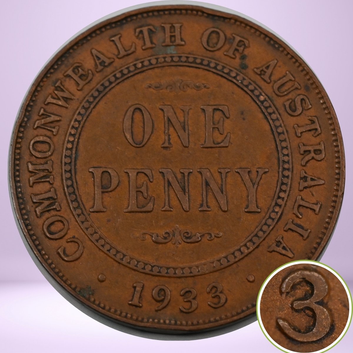 Copper 1933/2 overdate penny from the Commonwealth of Australia with 'One Penny 1933' text. Close up of '3 struck over the 2'