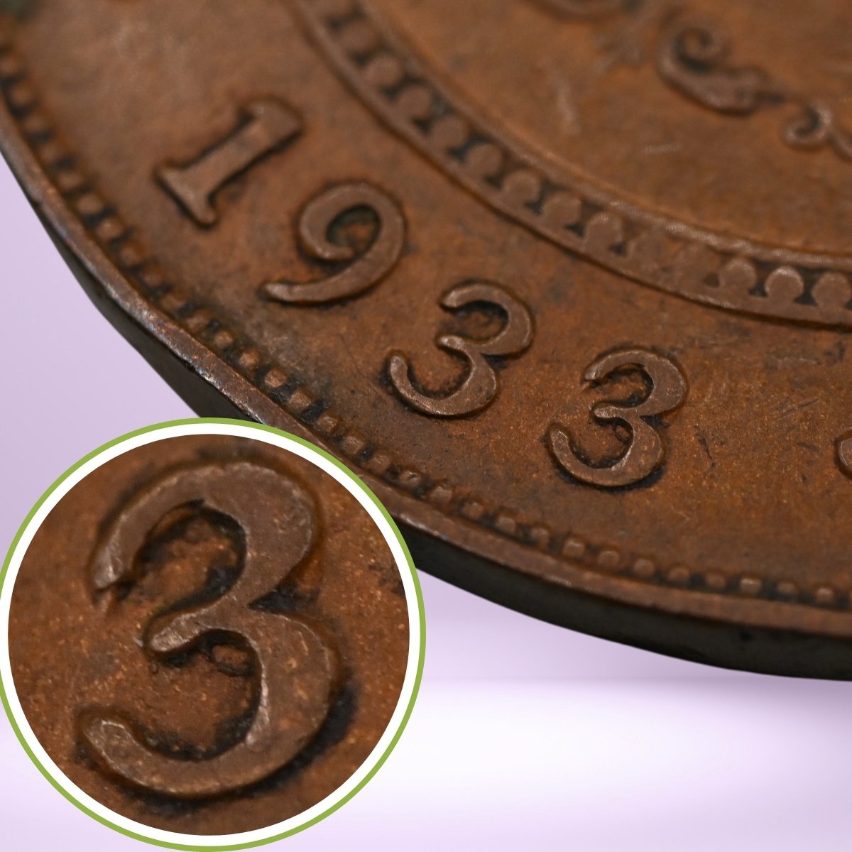 Close-up of a 1933/2 overdate copper penny with '1933' text, showing magnified '3 struck over 2' detail.