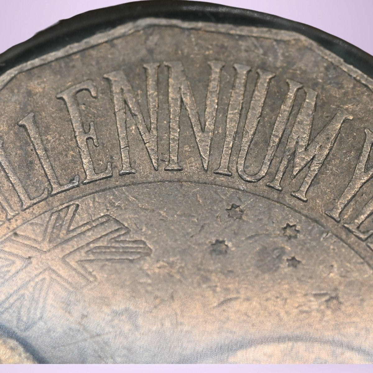 Close up 2000 50c Millennium Fat Letter with thickening in middle of 'NIUM' reverse of coin