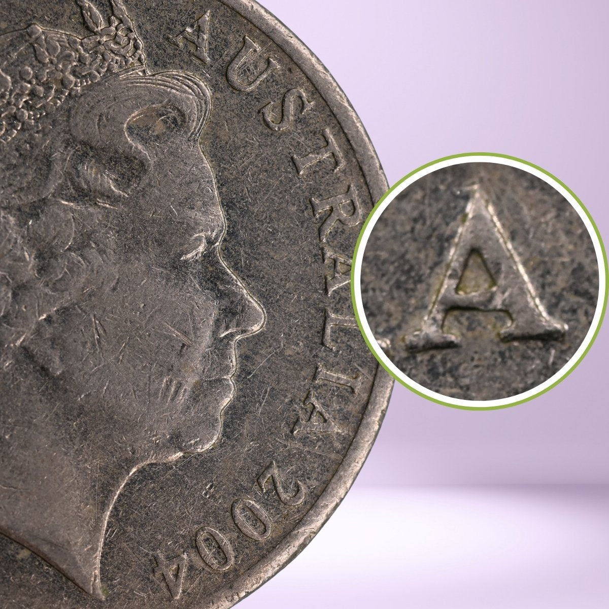 Close-up of a 2004 20c Australian coin with a magnified Pointy 'A' on obverse