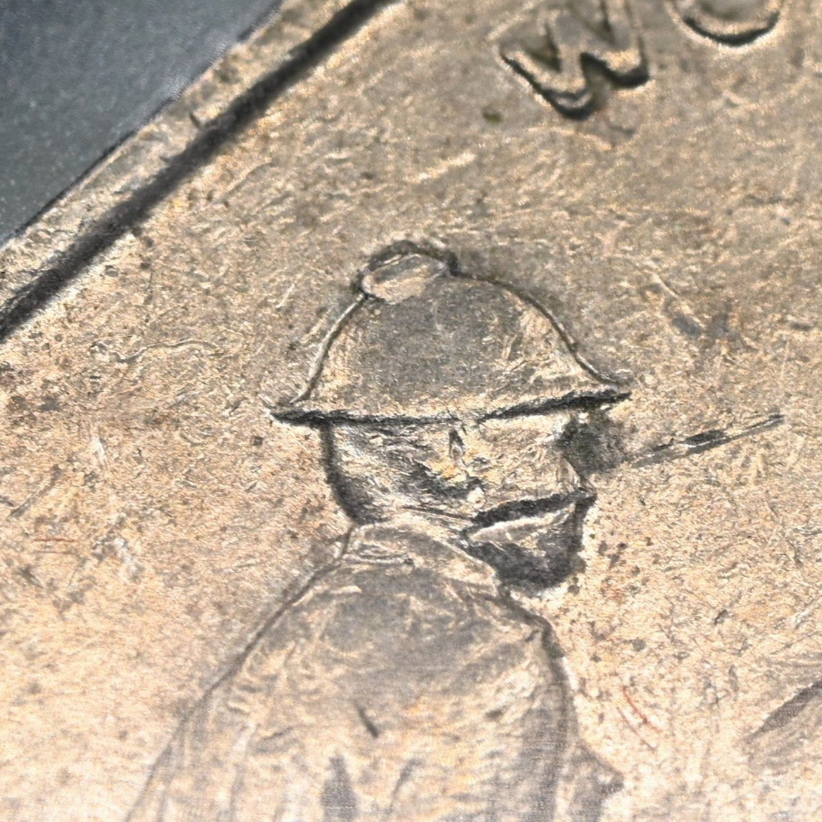 Close up of 2005 Australian 50 Cent Coming Home WWII Coin with a CUD error on the soldier's helmet.