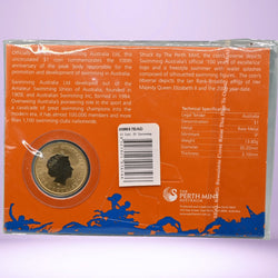 Packaged 2009 $1 Perth Mint coin with detailed text and specifications on an orange background