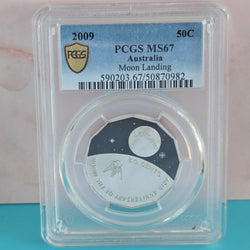 2009 50c Moon Landing coloured Coin in a protective case with PCGS grading label MS67
