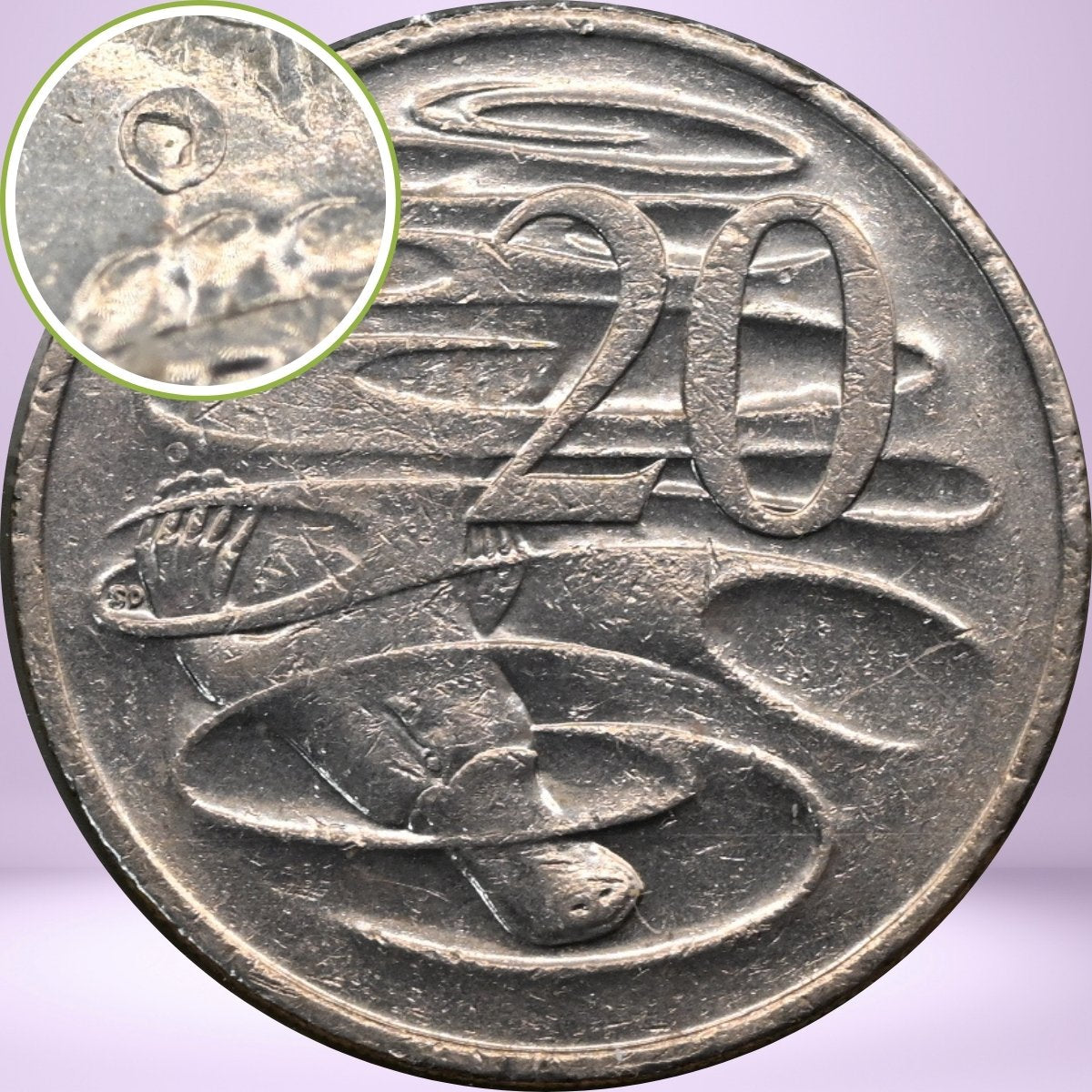 Close up with magnified image bubble error above platypus paw 2010 20c reverse - loose