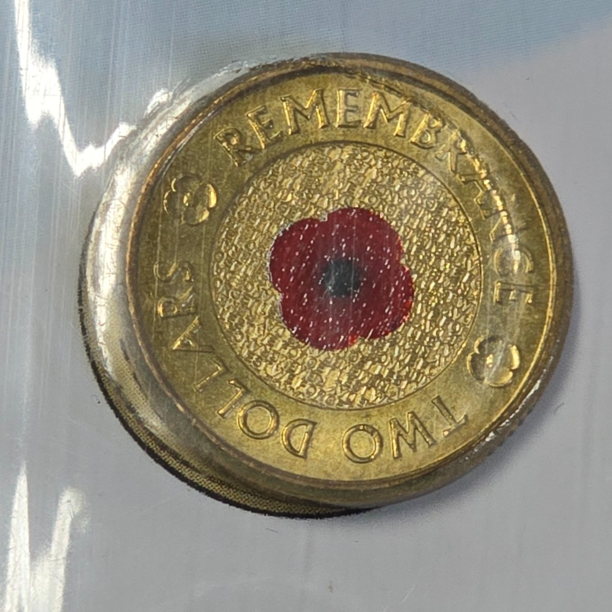 2012 $2 Remembrance Day Red Poppy on RSL Lest We Forget $10 Certificate of Donation glued to card, reverse shown