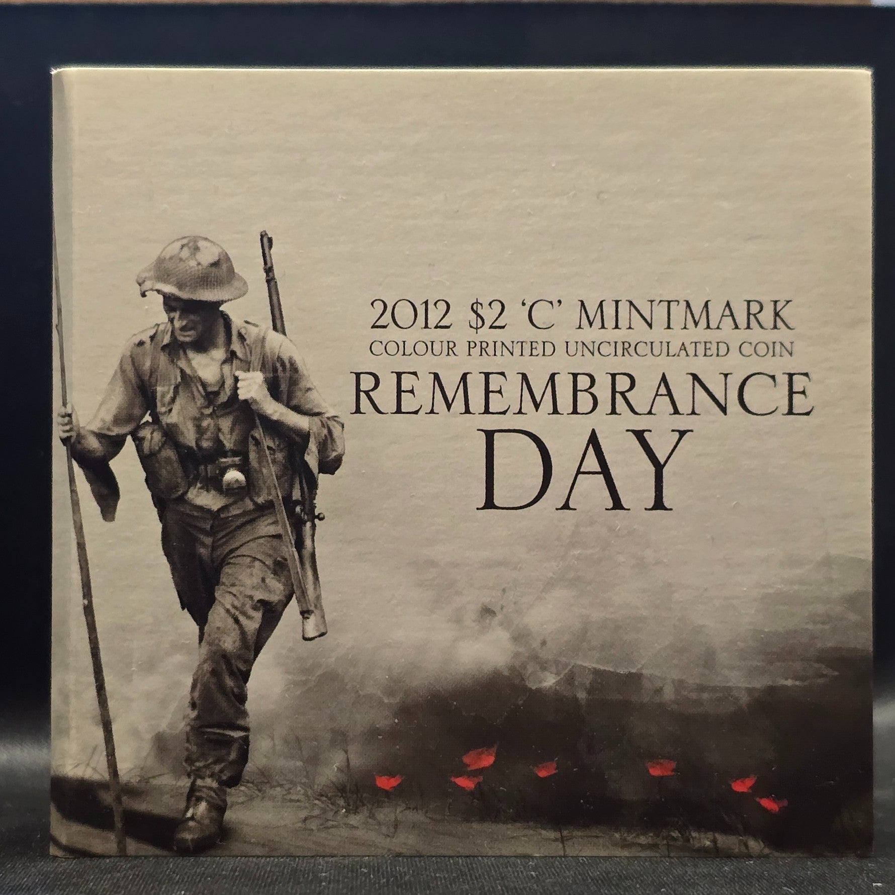 2012 $2 C-Mintmark Remembrance Red Poppy Coloured Uncirculated Trifold Carded Coin