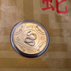 2013 $1 Lunar Series Year of the Snake Uncirculated Coin struck to specimen quality reverse with snake, year above, 'Year of the Snake' text below and Chinese motifs
