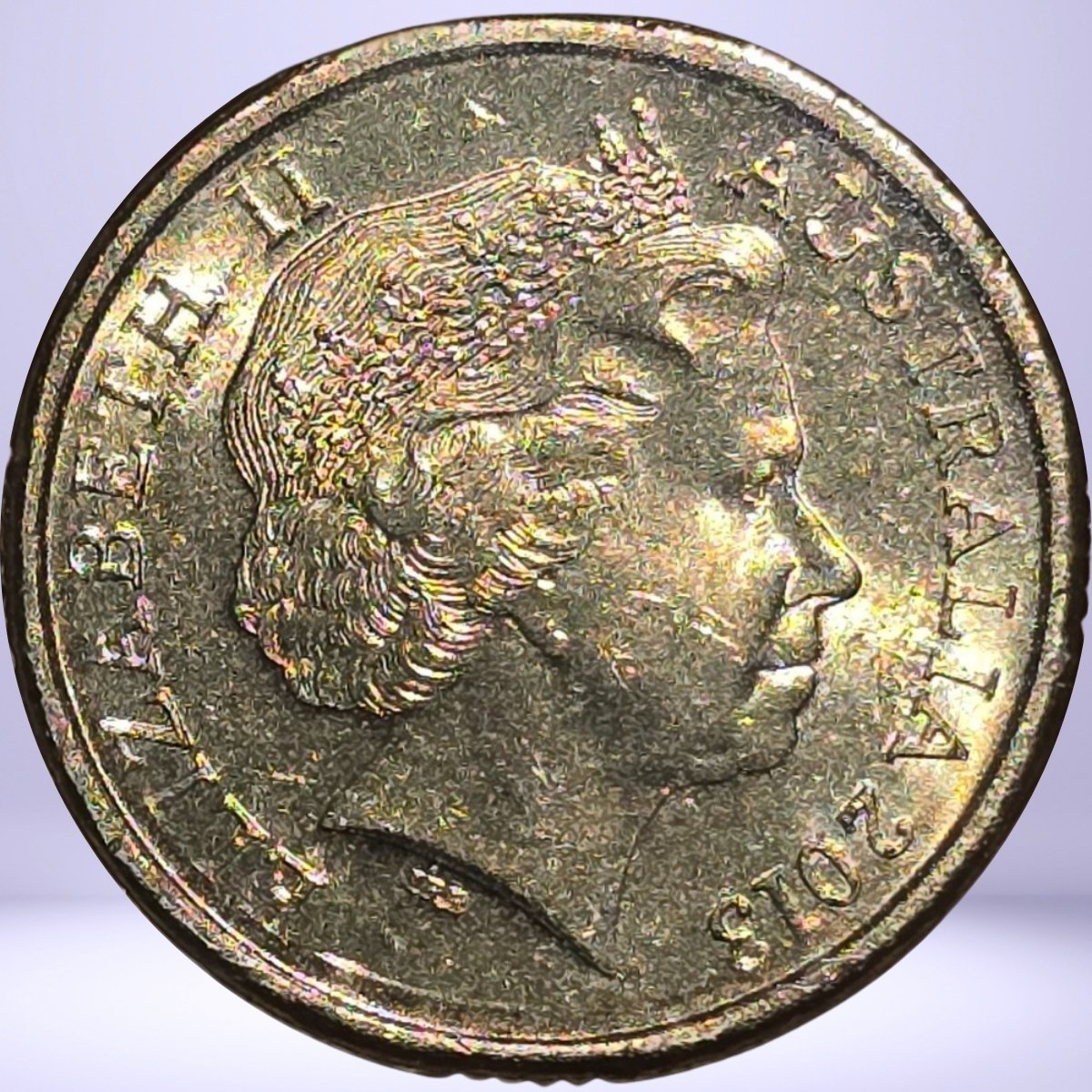 Close up obverse 2013 $2 circulated Queen Elizabeth II Purple Coronation coin with QEII IRB effigy