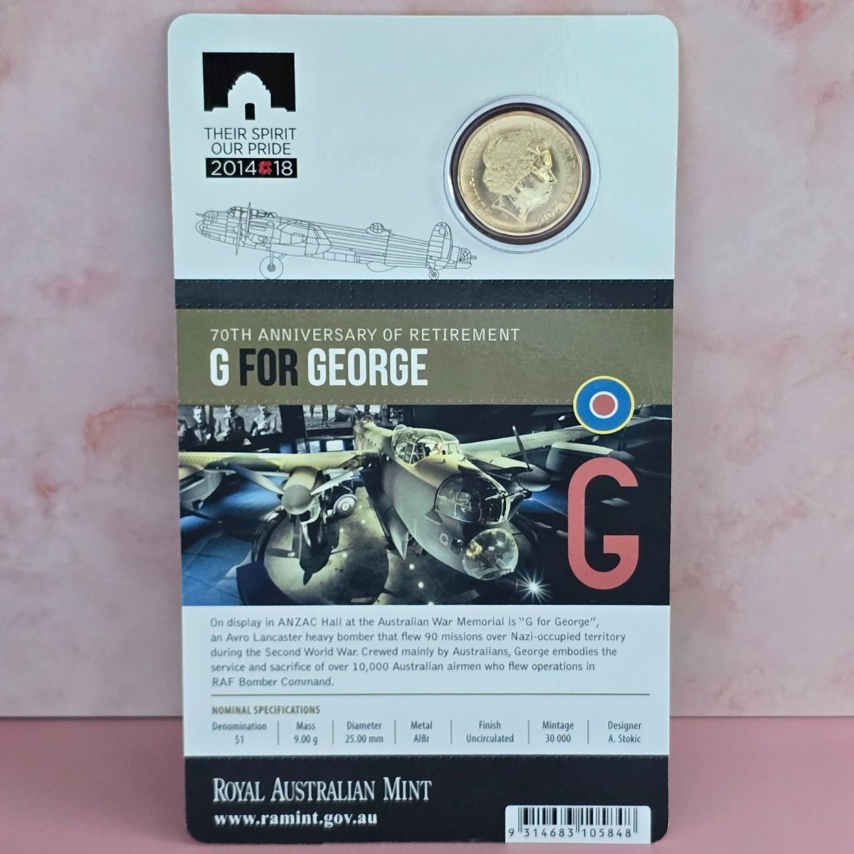 2014 $1 obverse side of coin in display card with '70th Anniversary of Retirement G for George' text history and nominal specifications