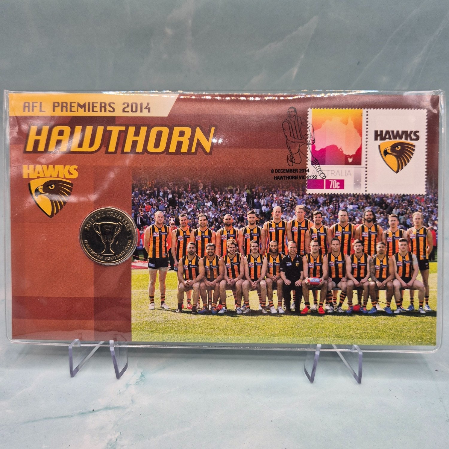 Front of 2014 $1 AFL Premiers Hawthorn Hawks PNC with team photo, colours and logo - reverse