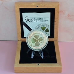 Silver 2014 $5 Republic of Palau Ounce of Luck coin with real four-leaf clover central inclusion in a wooden box with a certificate of authenticity