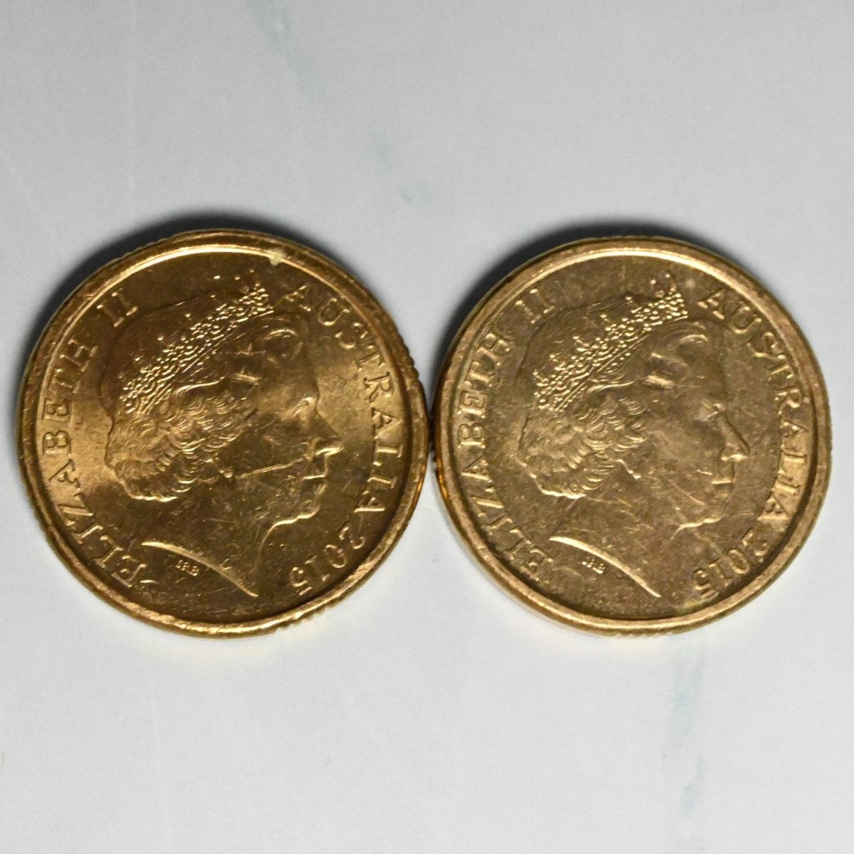 2015 $2 Red ANZAC Cove and Orange Flanders Fields Remembrance coins in circulated condition obverse side