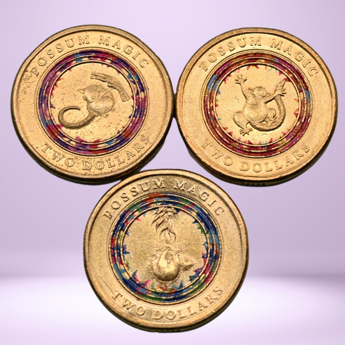 Close up reverse 3x 2017 $2 coloured Possum Magic coins