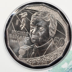 2017 50c Richie Benaud uncirculated coin reverse with likeness of Richie Benaud and cricketer in the background