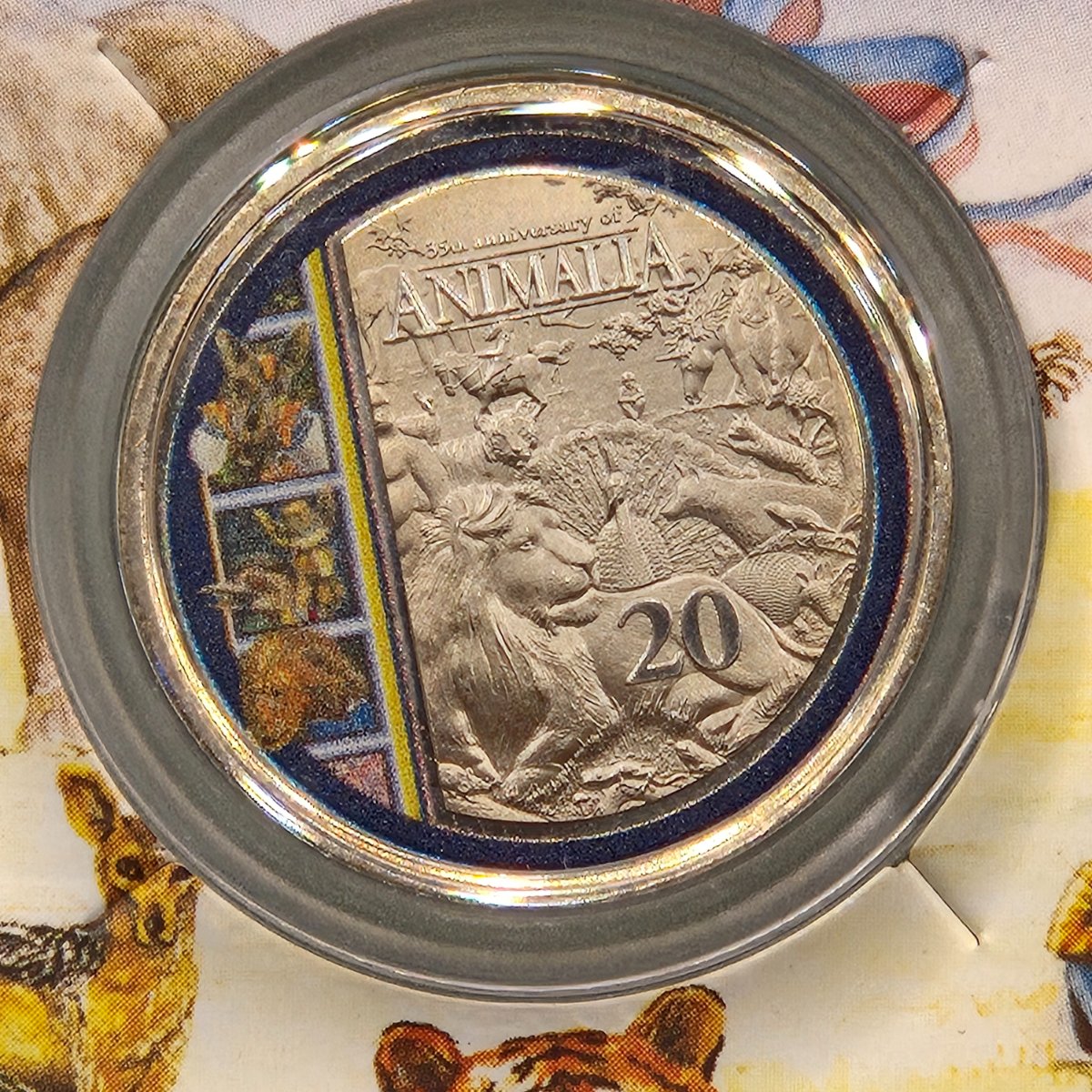 Close up of 2021 20c 35th Anniversary of the Animalia Book by Graeme Base Coloured Coin on card