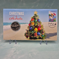 Front of 2021 50c PNC with Christmas tree on a beach scene, featuring 'Christmas in Australia' text.