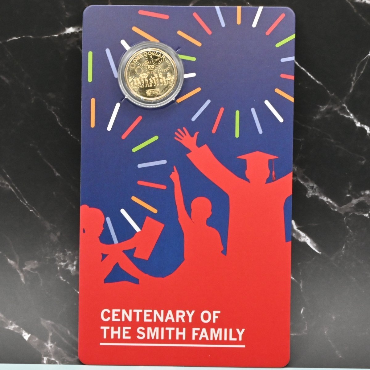 2022 $1 Centenary of the Smith Family carded coin - reverse