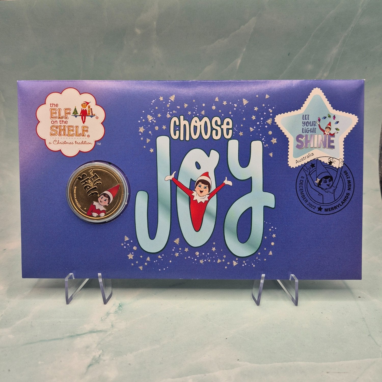 2022 $1 Elf on the Shelf Choose Joy Perth Mint coloured coin PNC with images of Elf - reverse