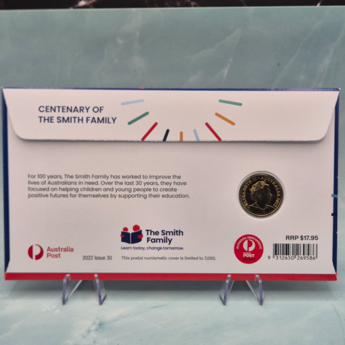 Back of 2022 $1 Centenary of the Smith Family PNC with Envelope Privy Mark on the reverse of the $1 coin