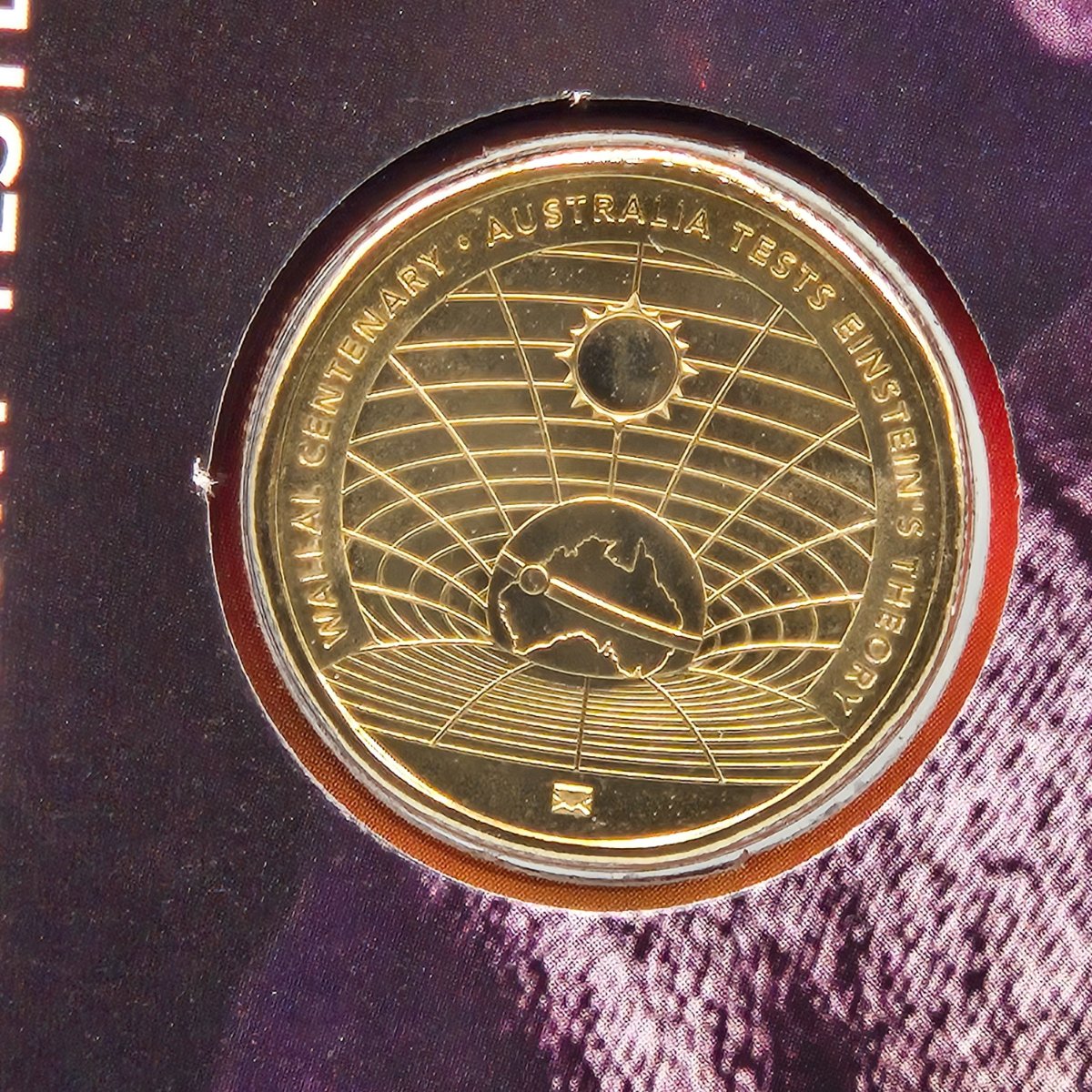 close up of 2022 $1 Wallal Centenary commemorative PNC celebrating a century of Eintstein's theory being tested in Australia - Envelope Privy Mark on coin - reverse side