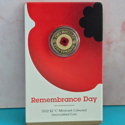 2022 two dollar $2 Remembrance Red Poppy coin with central red poppy design on a 'Remembrance Day' card - coin reverse