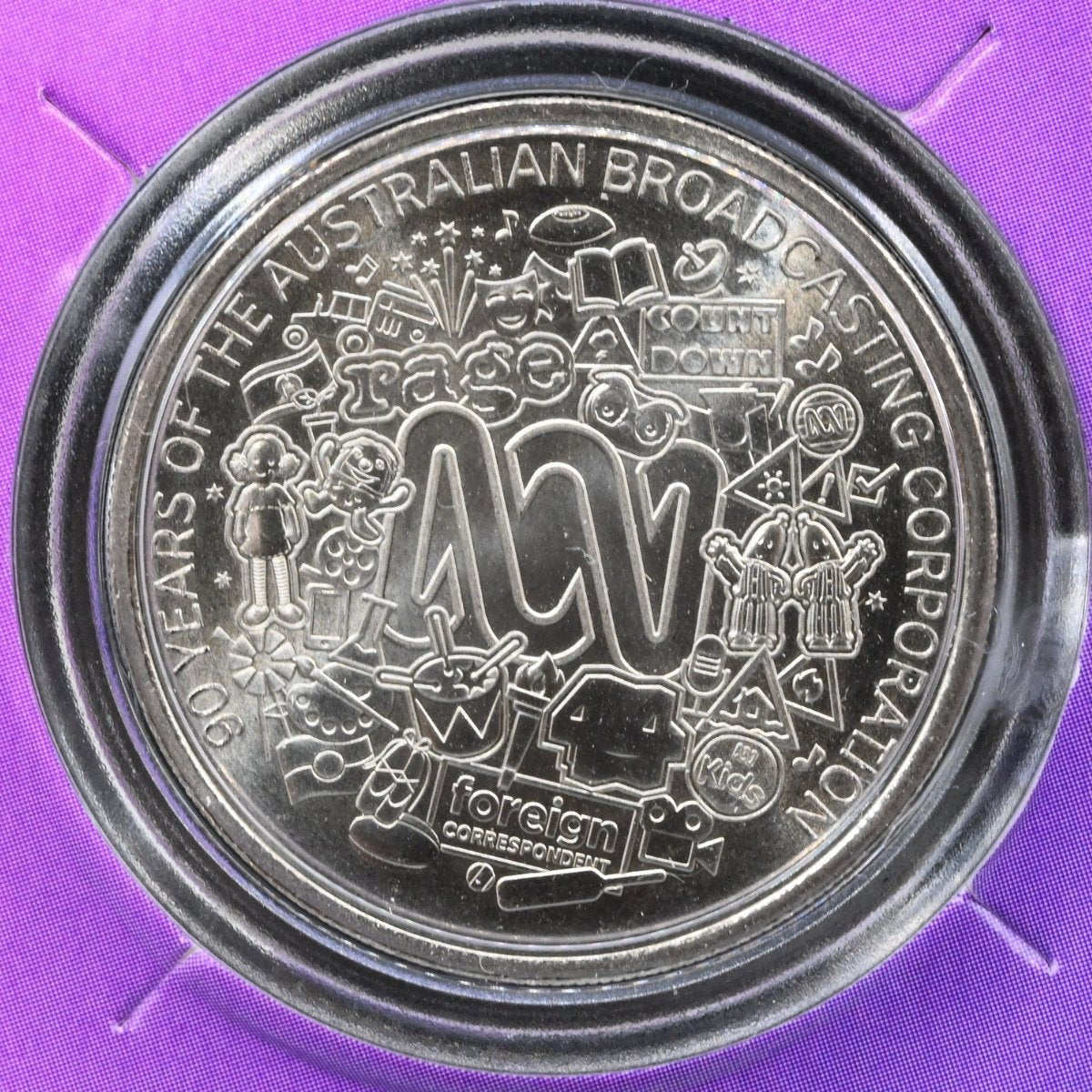 Close up of 2022 20c with text '90 Years of the Australian Broadcasting Corporation' on purple card - reverse