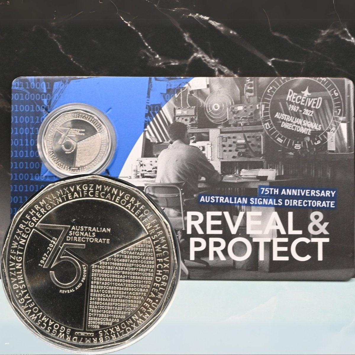 2022 50c coin with 'Australian Signals Directorate' branding and packaging - with enlarged image showing secret code reverse of coin