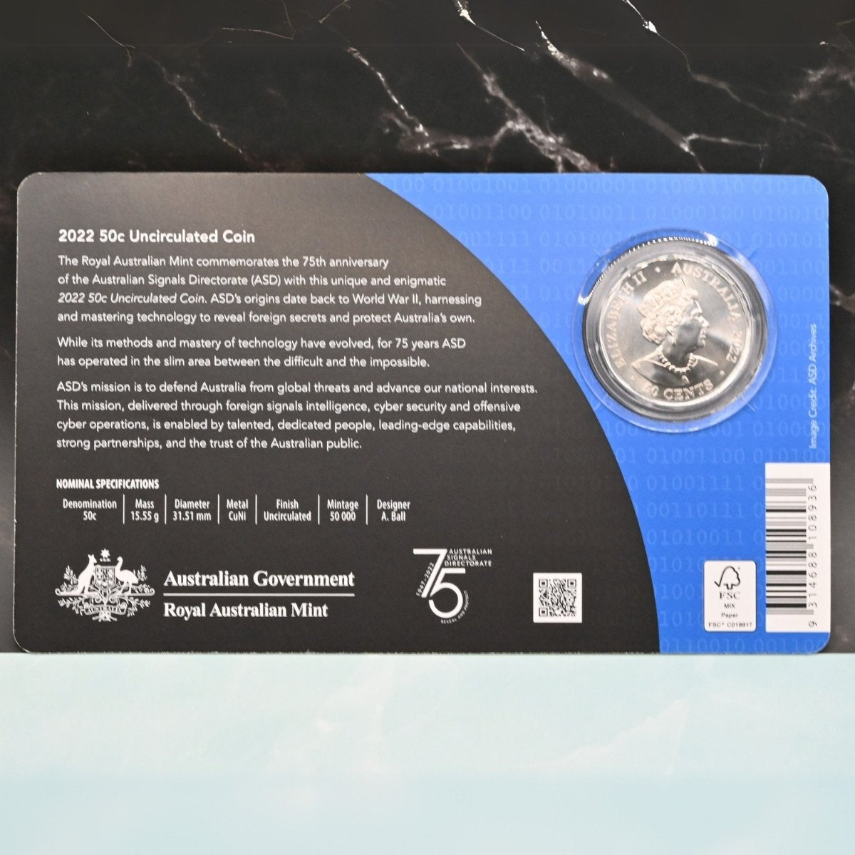 2022 50c Reveal and Protect coin with packaging and text including nominal specifications
