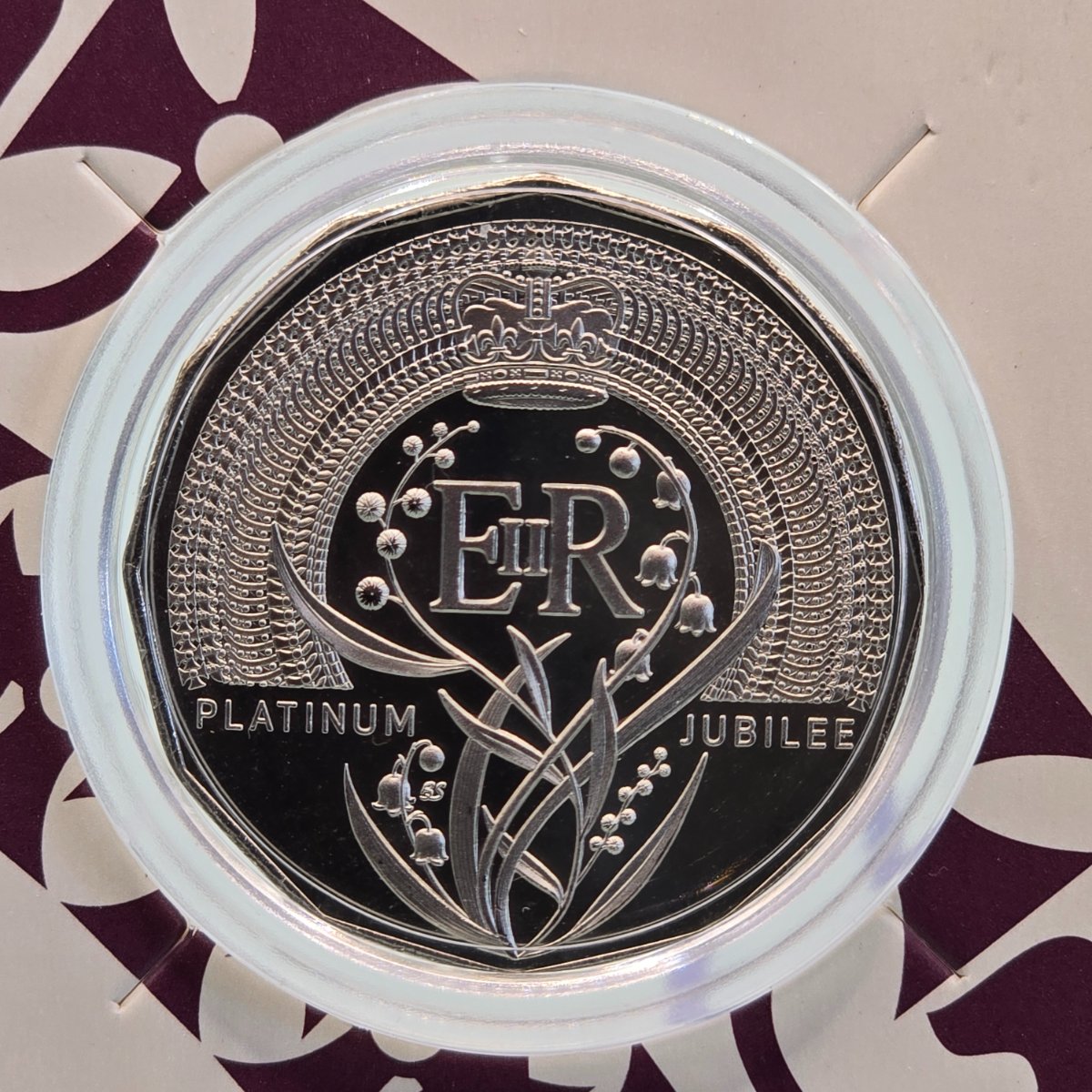 2022 50c Platinum Jubilee of Her Majesty Queen Elizabeth II small carded coin struck by the Royal Australian Mint close up reverse of coin
