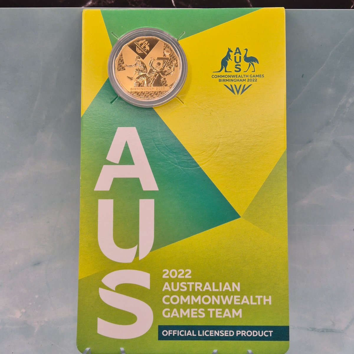 2022 Gold Plated 50c coin commemorating the Australian Commonwealth Games Team that competed in Birmingham on card