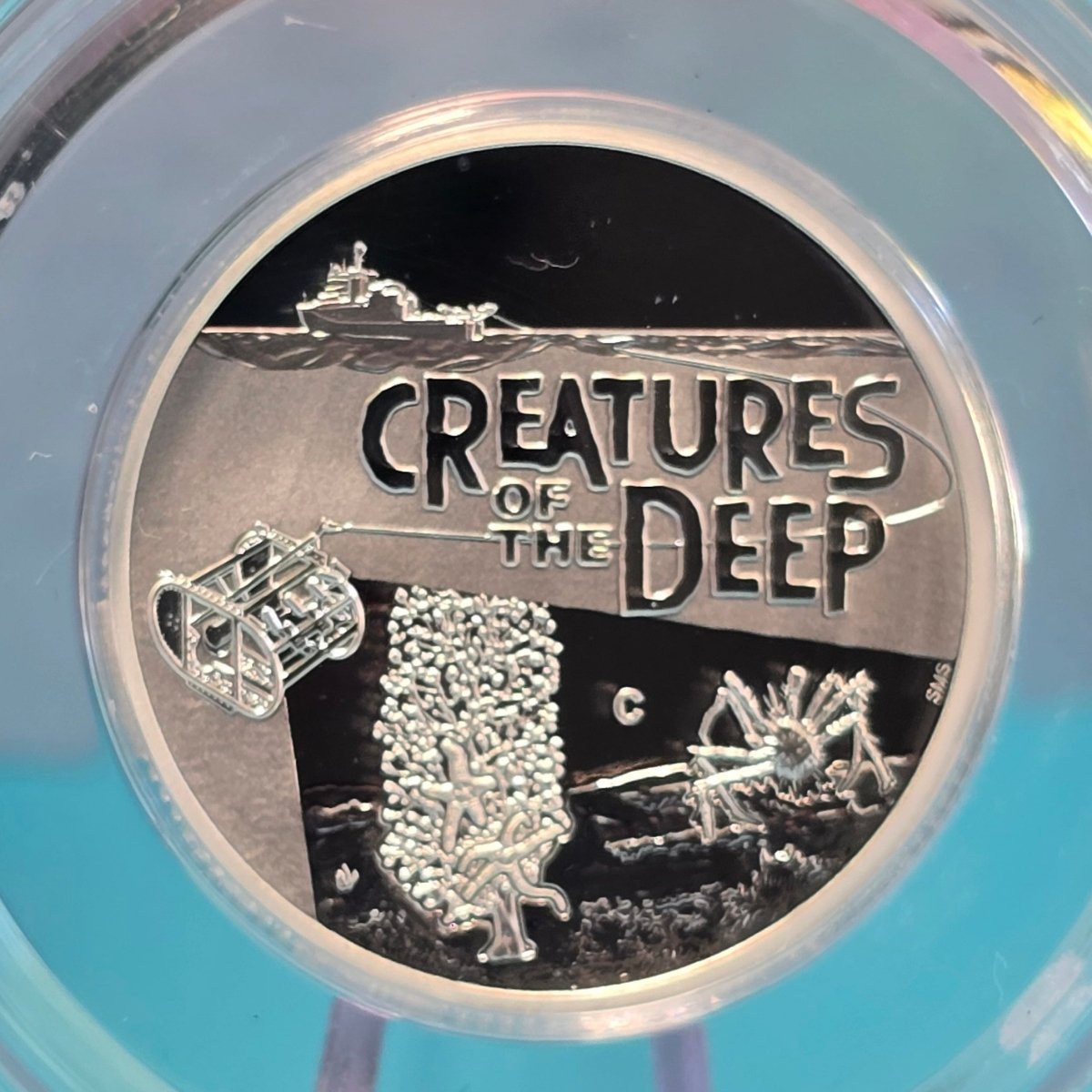 2023 $1 coin with 'Creatures of the Deep' design and 'C' Mintmark - reverse of coin