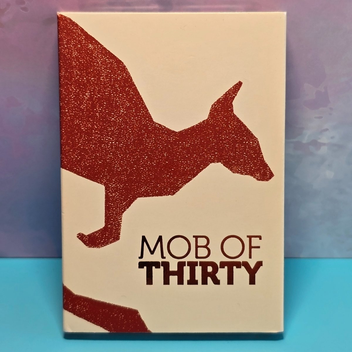 Beige packaging with red kangaroo silhouette and 'MOB OF THIRTY' text