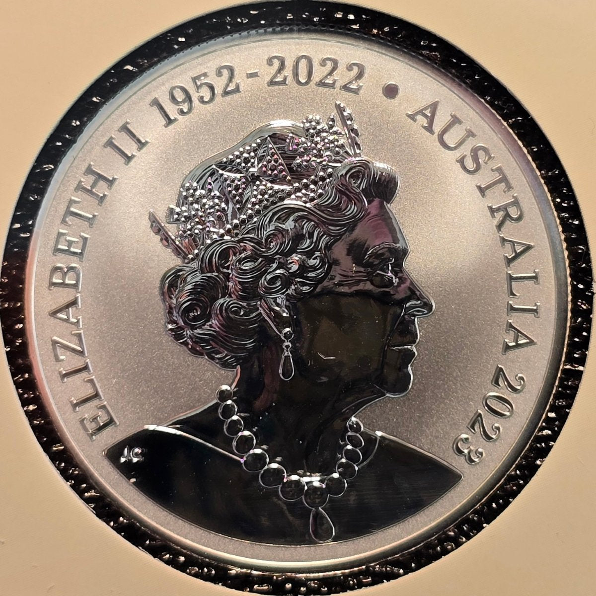 2023 $1 Mob of Thirty Frosted Uncirculated coin obverse with portrait of Elizabeth II and text 'Elizabeth II 1952-2022 Australia 2023' on a beige background