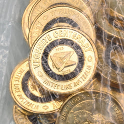 2023 $2 close up of reverse side of coins with 'Vegemite Centenary' text and black colour design, in security bag.