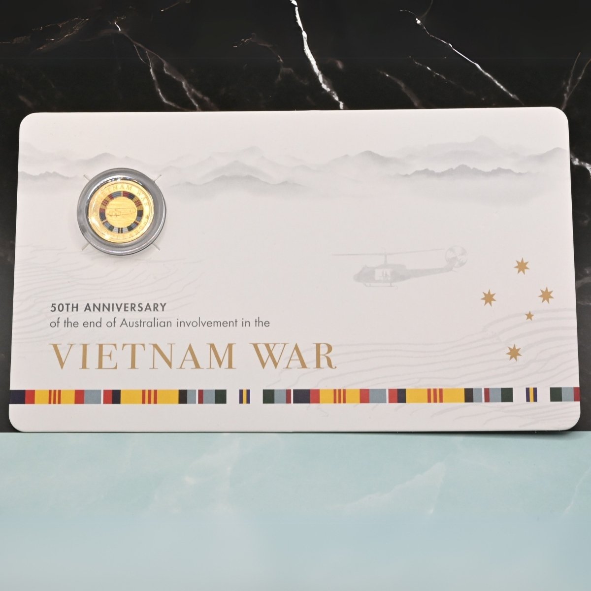 2023 $2 'C' Mintmark coloured coin on card commemorating the 50th anniversary of the end of Australian involvement in the Vietnam War - reverse