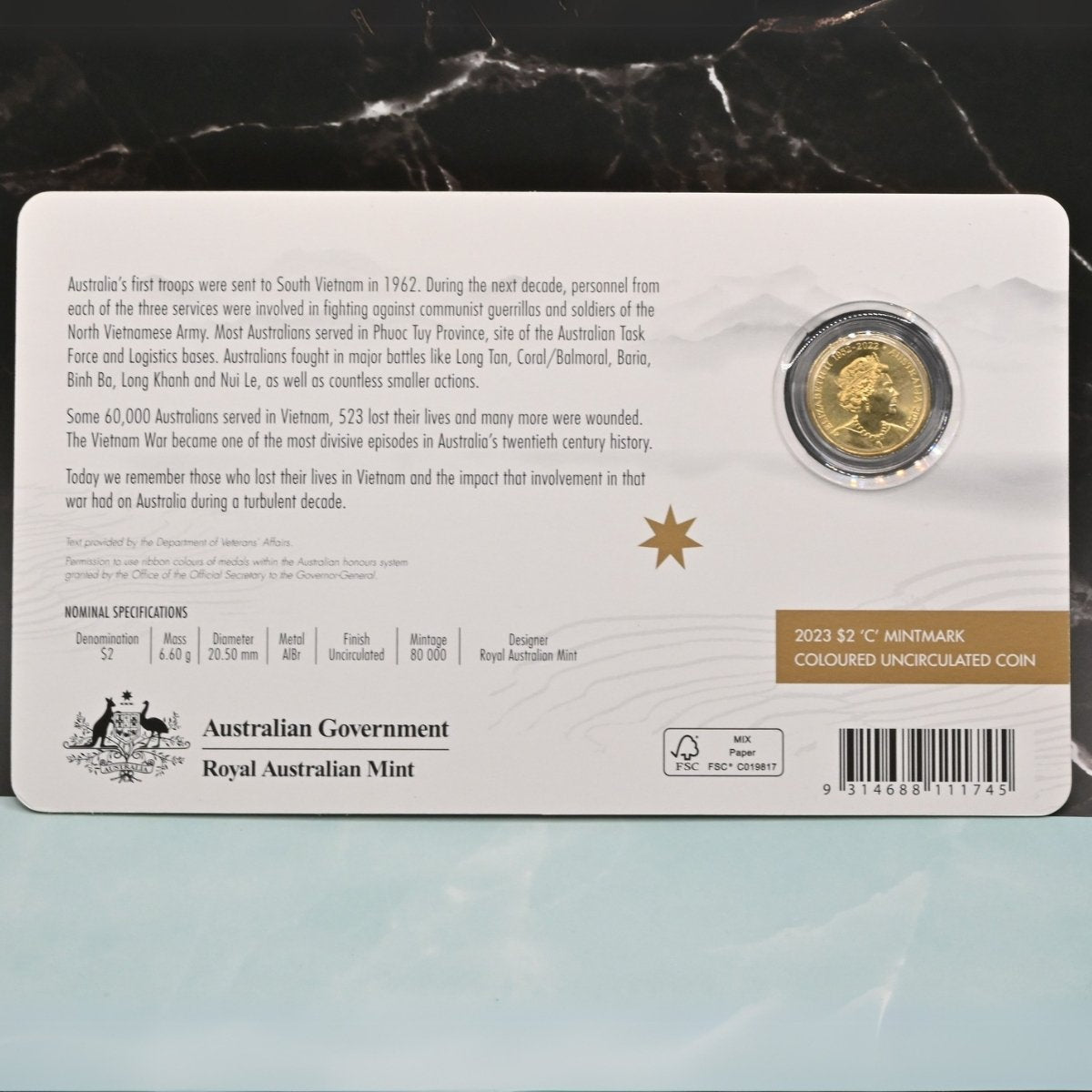 2023 $2 'C' Mintmark coloured coin on card commemorating the 50th anniversary of the end of Australian involvement in the Vietnam War - obverse