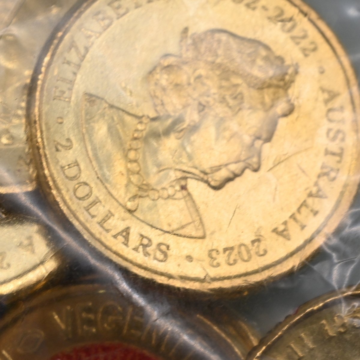 2023 $2 close up of obverse - Queen Elizabeth II effigy in security bag - has minor contact marks