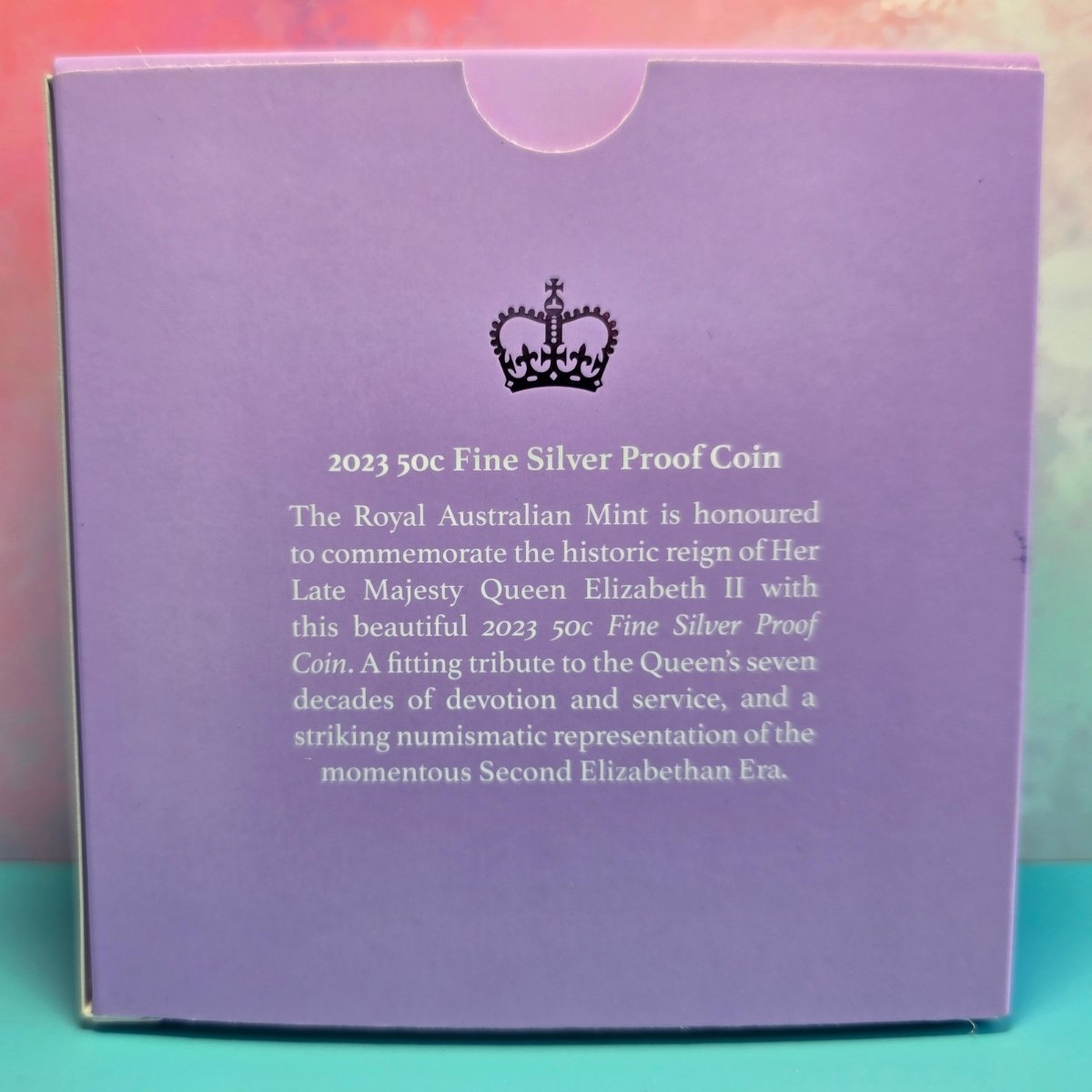 Purple box with text and a crown emblem, for 2023 Queen Elizabeth II Memorial 50c silver proof commemorative coin.