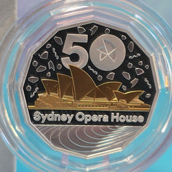 2023 50c Selectively gold plated silver coin with Sydney Opera House design and '50' in a clear protective case - reverse side