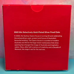 Red box with text about a 2023 50c Selectively Gold-Plated Silver Proof Coin related to the Sydney Opera House.