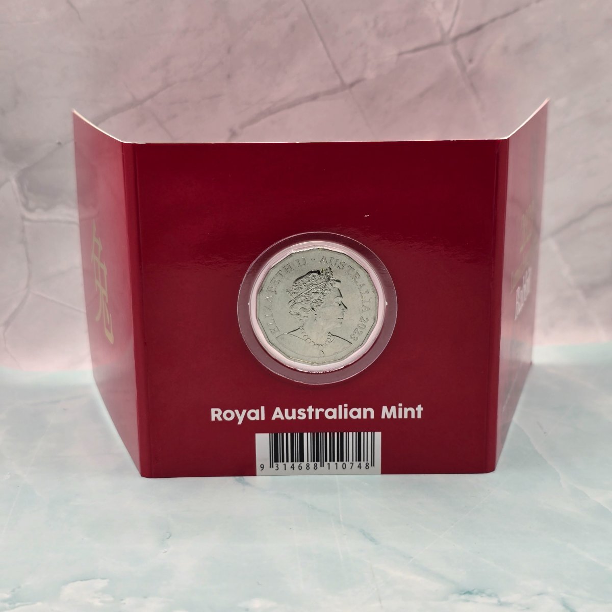 2023 50c Lunar Year of the Rabbit 50c Uncirculated Coin Tetra Decagon Series back of red trifold with gold foil accents