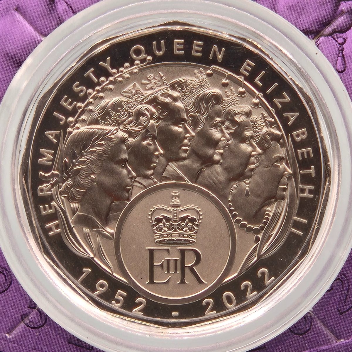 Close up 2023 50c EIIR Her Majesty Queen Elizabeth II Memorial commemorative coin in a purple card