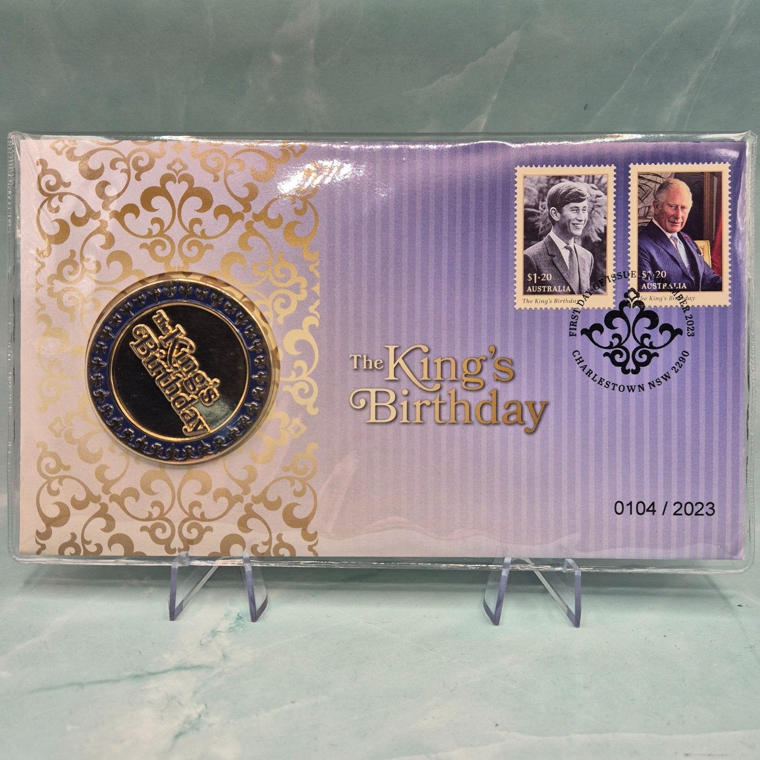 2023 Philatelic Medallion Cover in purple and gold - text on envelope and medallion 'The King's Birthday' - stamps of KCIII young and mature