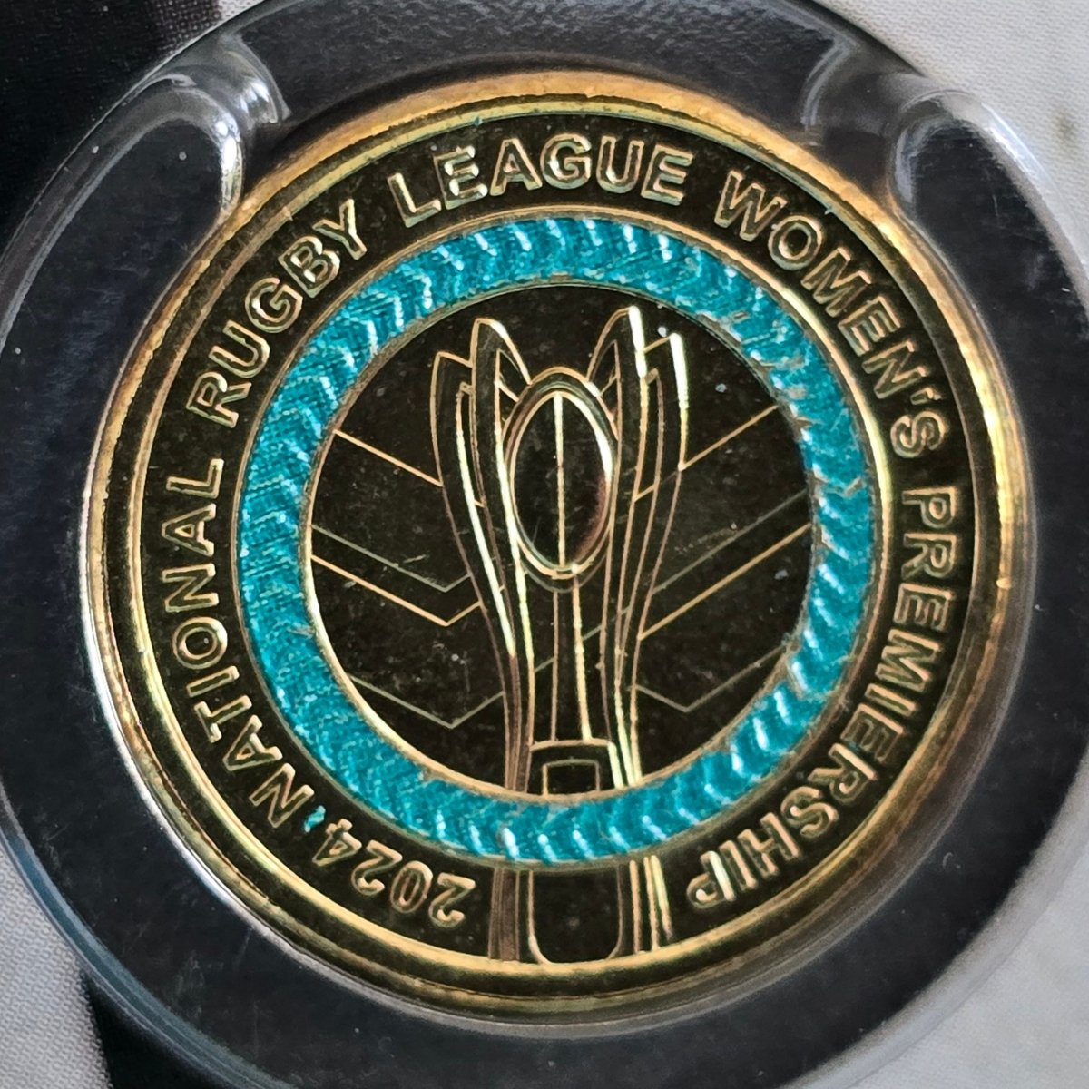 Reverse of 2024 $2 coloured National Rugby League Women's Premiership Coin close up