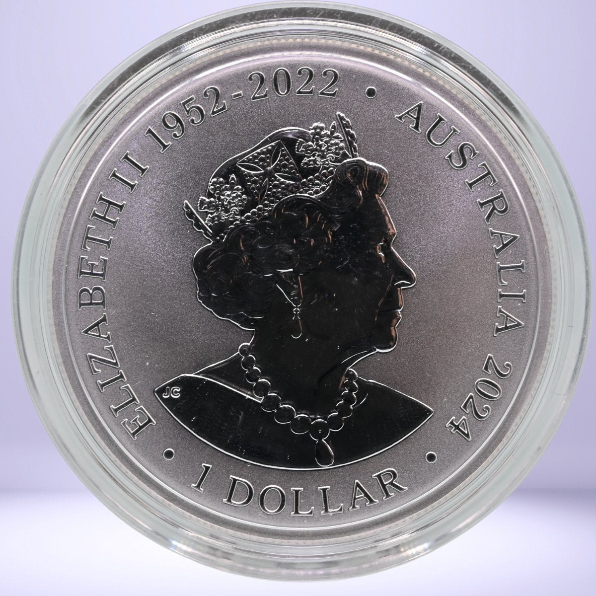 2024 $1 silver bullion coin with profile of Queen Elizabeth II and text 'Elizabeth II 1952-2022 Australia 2024' - obverse - in capsule