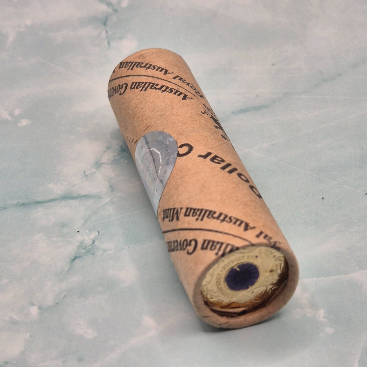 2024 $2 Royal Australian Mint Roll Remembrance War Animals showing reverse coloured Purple Poppy with paint chips