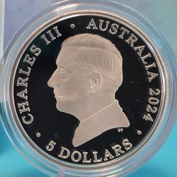 Silver coin with a profile of a monarch and text 'Charles III Australia 2024 5 Dollars' on a clear background