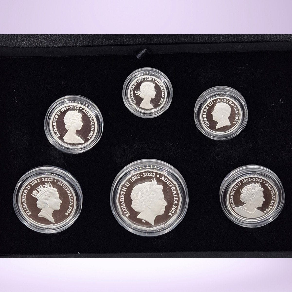 Set of Australian 2024 silver coins with five Queen Elizabeth II portraits and one King Charles III portrait - obverse of coins