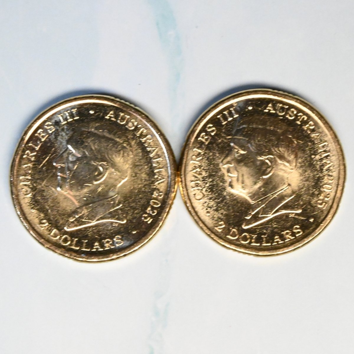 2025 $2 pair of Australian Open coins obverse shown with text 'Charles III Australia 2025 2 Dollars'